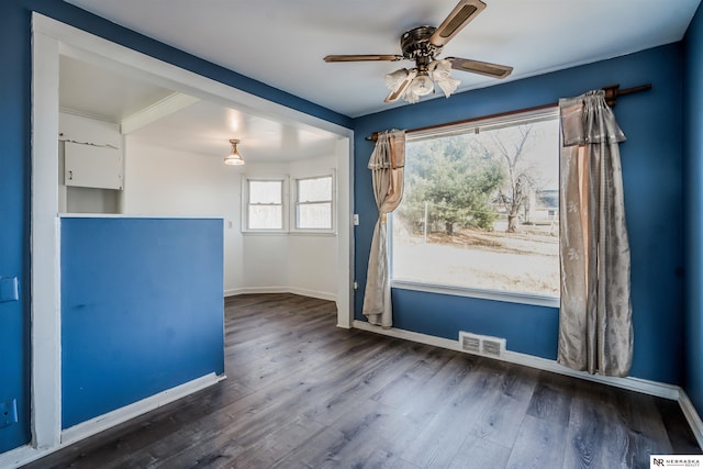 empty room featuring hardwood / wood-style floors and ceiling fan