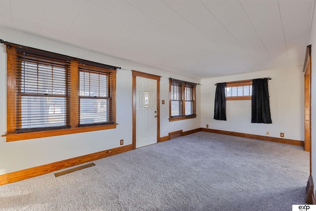 foyer with carpet flooring