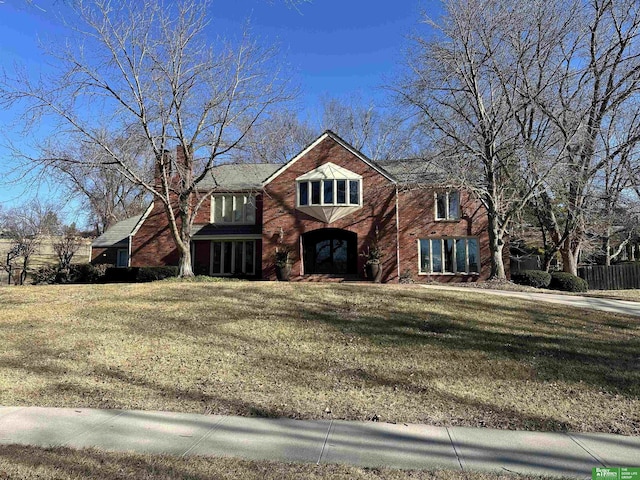 view of property featuring a front yard