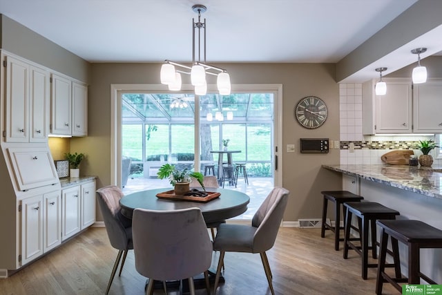 dining space featuring light hardwood / wood-style flooring