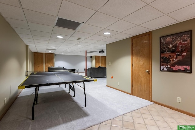 recreation room featuring a paneled ceiling