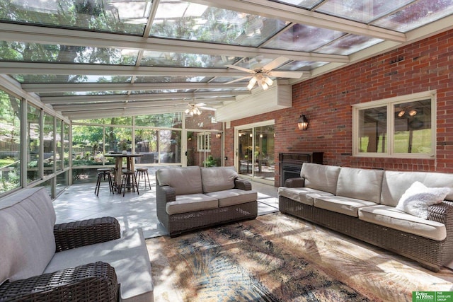 sunroom with beam ceiling and ceiling fan