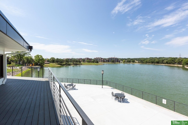 wooden deck featuring a water view