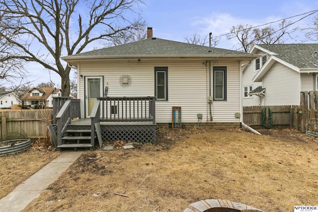 back of property featuring a deck