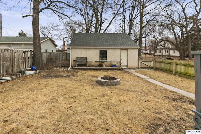 view of yard with an outdoor fire pit