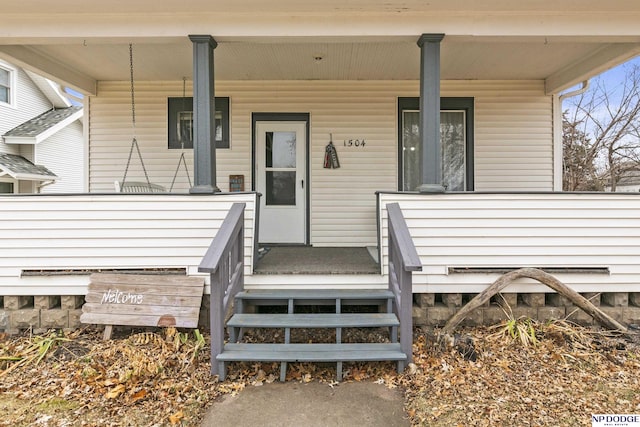 entrance to property with covered porch