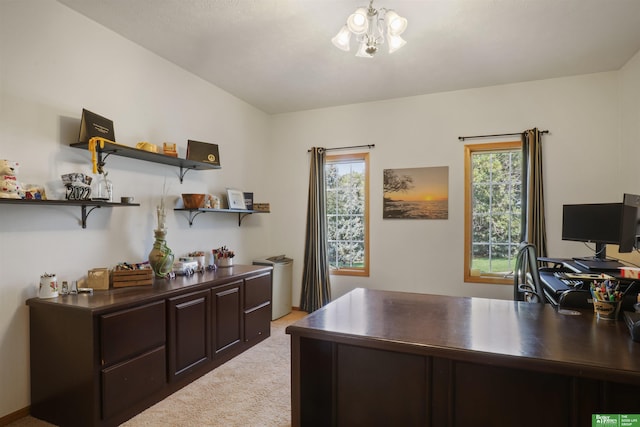 carpeted home office with a chandelier and a healthy amount of sunlight