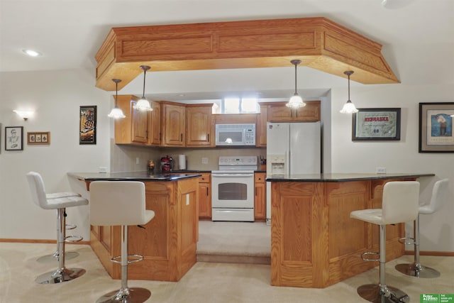 kitchen with white appliances, a kitchen bar, decorative light fixtures, and decorative backsplash