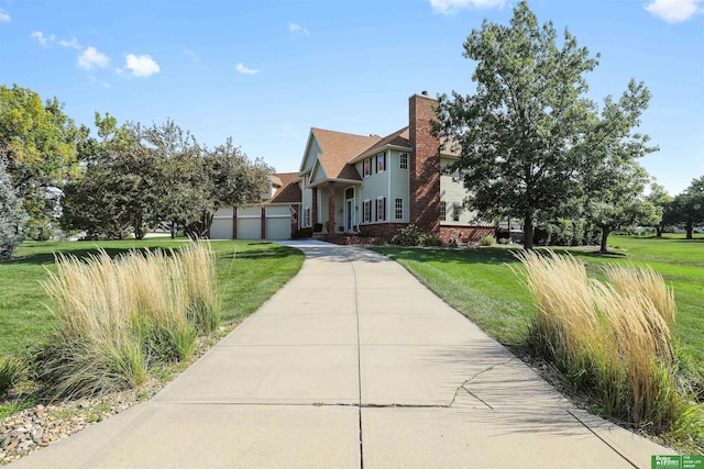 view of front of house featuring a garage and a front yard