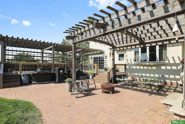 view of patio / terrace featuring an outdoor fire pit and a pergola