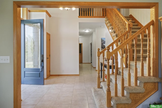 entryway with light tile patterned floors