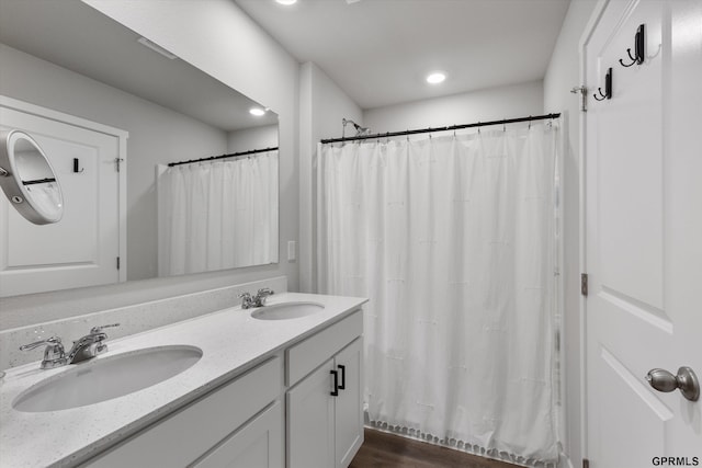 bathroom with a shower with curtain and vanity