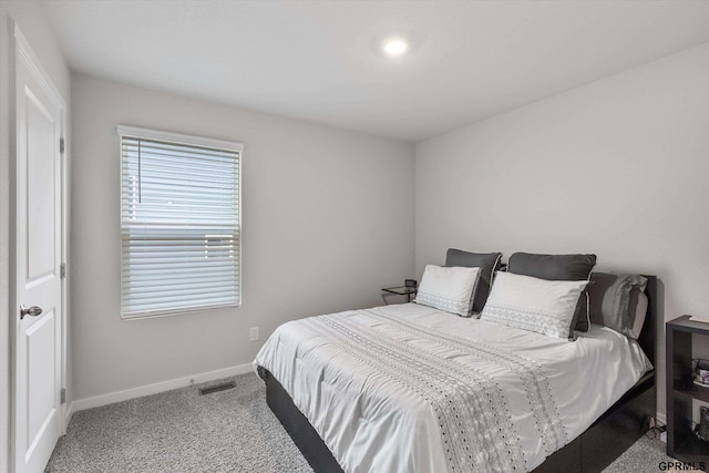 bedroom with light carpet