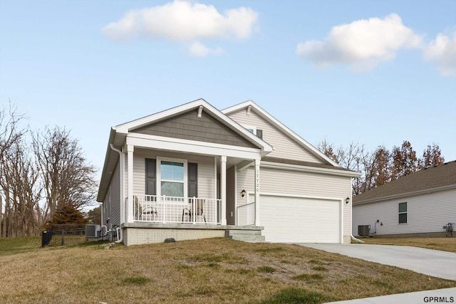 view of front of home featuring central AC, a porch, and a front lawn