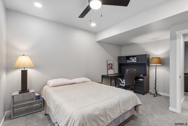 bedroom featuring ceiling fan and light colored carpet