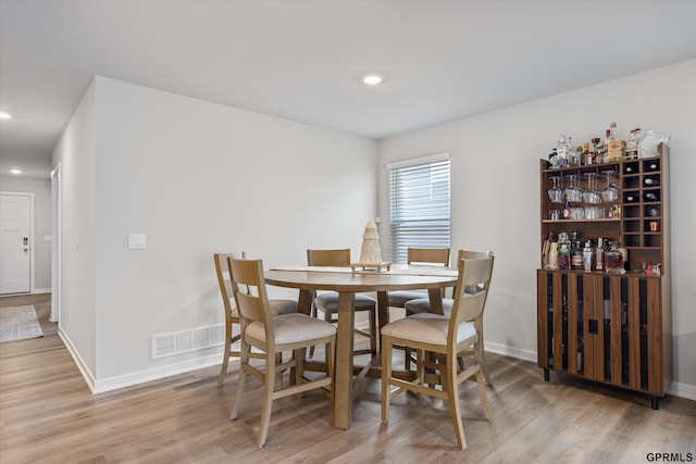 dining area with light hardwood / wood-style flooring