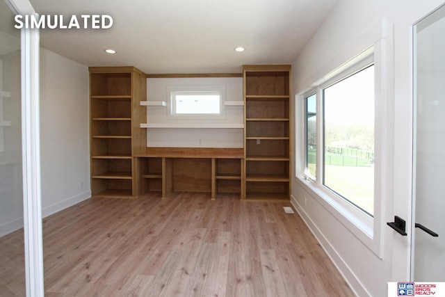 unfurnished living room featuring light hardwood / wood-style flooring