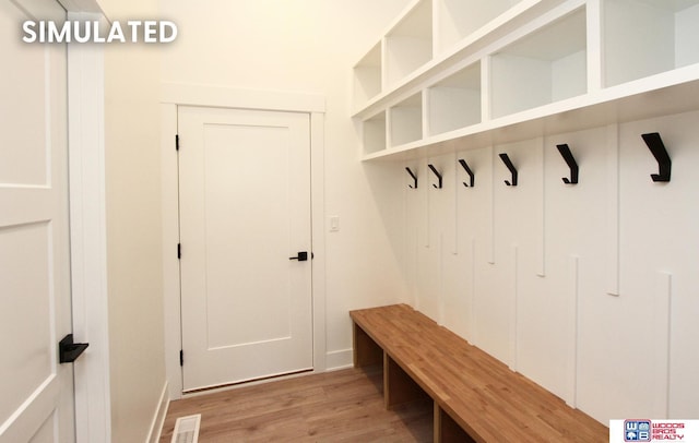 mudroom with light hardwood / wood-style floors