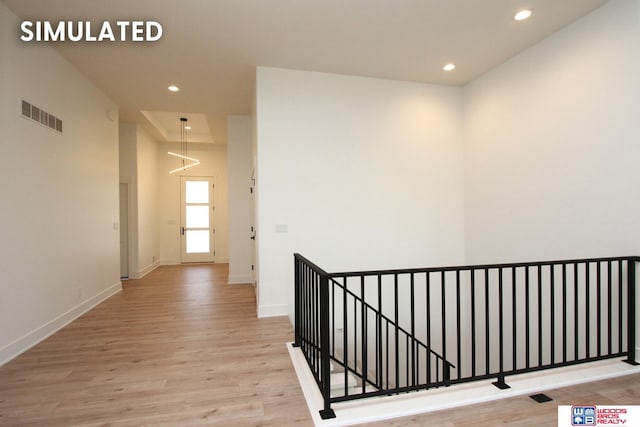 corridor with light hardwood / wood-style flooring