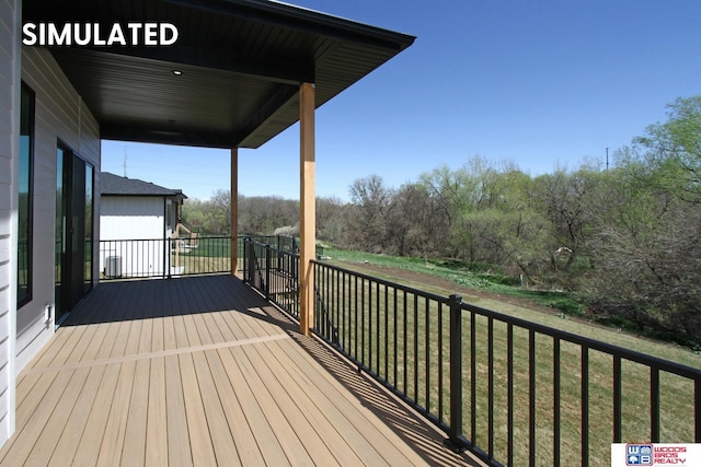 wooden terrace with a yard