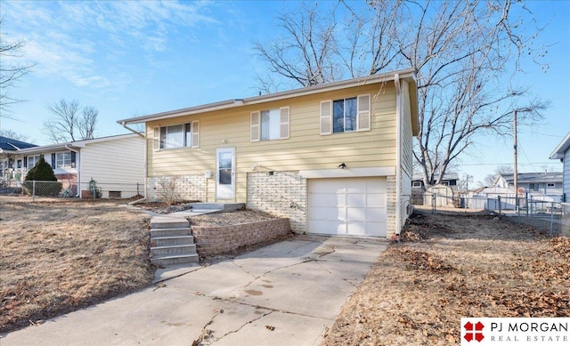 raised ranch featuring a garage