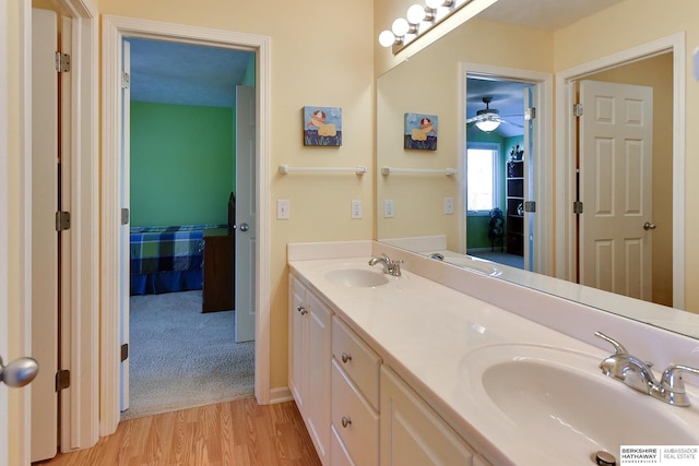 bathroom with vanity and hardwood / wood-style floors