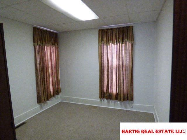 spare room featuring a paneled ceiling