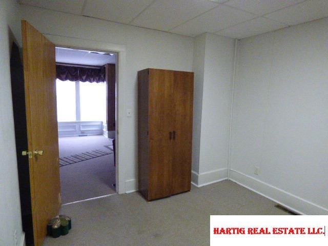 spare room featuring a paneled ceiling