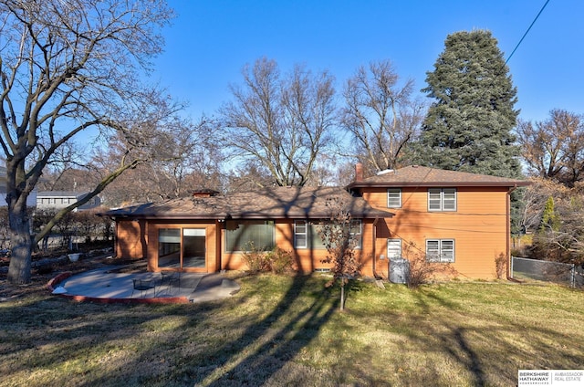 back of house with a yard and a patio area