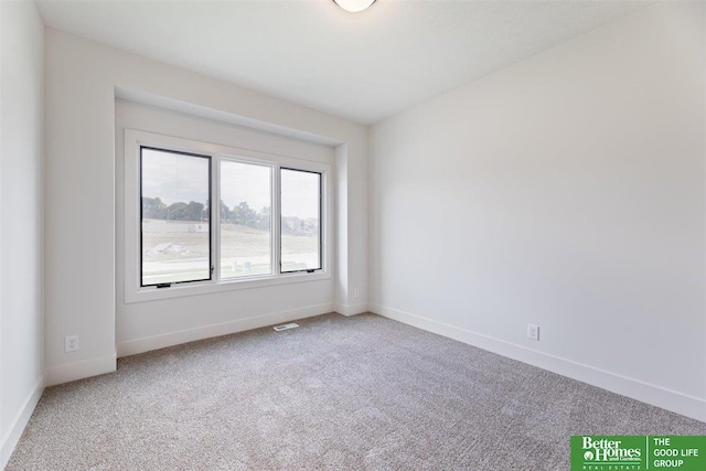 unfurnished room featuring carpet flooring