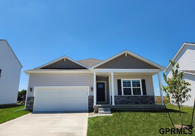 craftsman-style home featuring a garage and a front yard