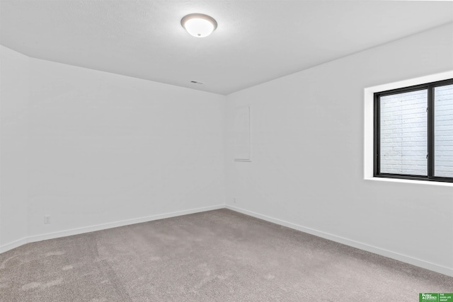 empty room with carpet flooring