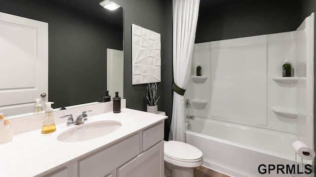 full bathroom featuring vanity, shower / bathtub combination with curtain, and toilet