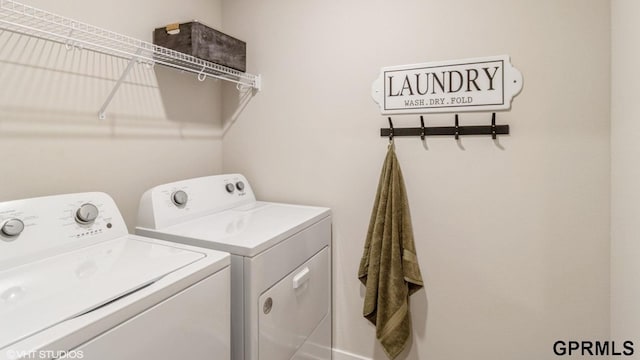 laundry room with washing machine and clothes dryer