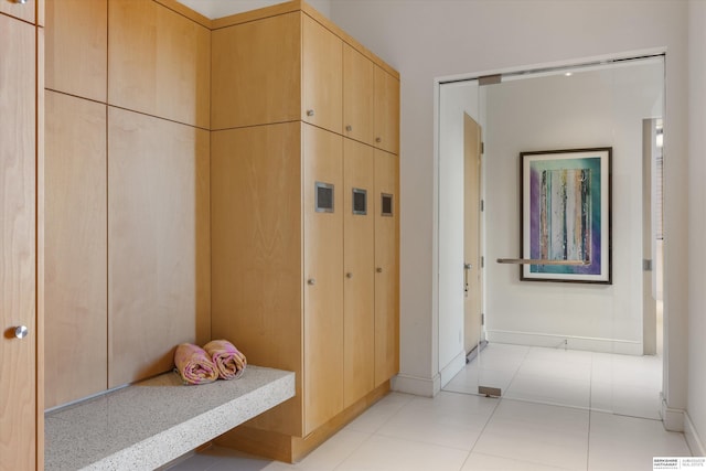 mudroom featuring light tile patterned flooring