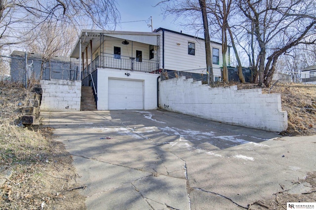 view of side of property with a garage