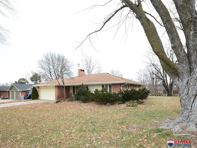 ranch-style home featuring a garage and a front lawn