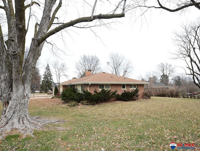 view of property exterior featuring a lawn