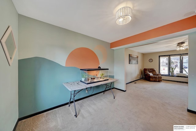 interior space featuring ceiling fan and light colored carpet