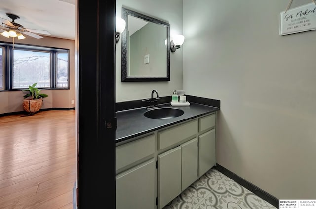 bathroom with vanity, wood-type flooring, and ceiling fan