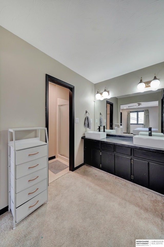 bathroom with vanity and an enclosed shower