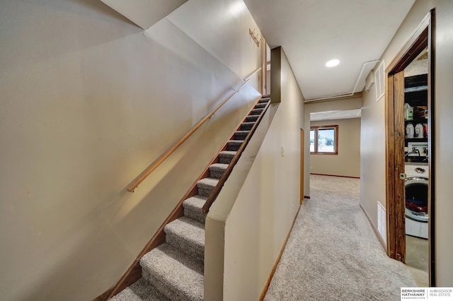 stairs with washer / dryer and carpet flooring