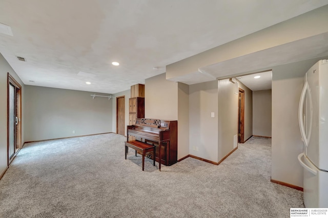 interior space featuring light colored carpet