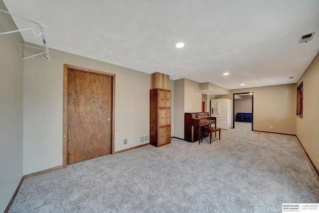 interior space featuring light colored carpet