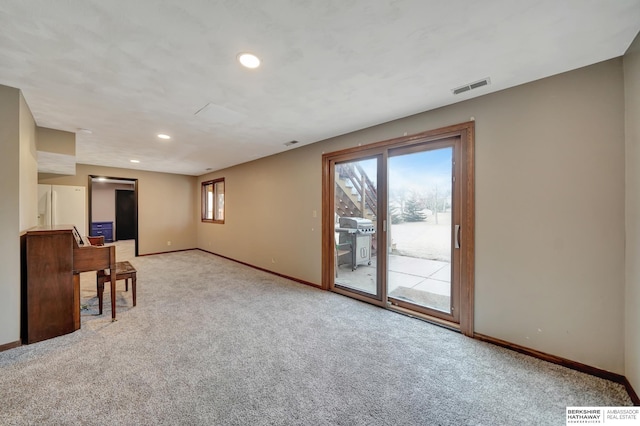 unfurnished living room with light colored carpet