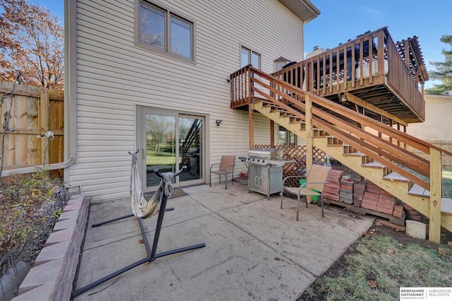 view of patio / terrace with a wooden deck and area for grilling