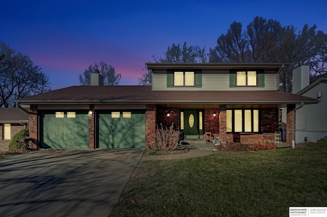 view of front facade with a garage, covered porch, and a lawn