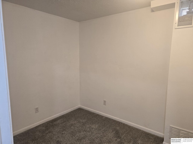 spare room featuring carpet