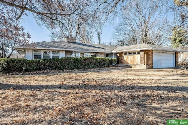 ranch-style home featuring a garage