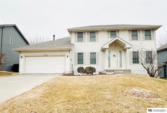 view of front facade featuring a garage and a front lawn